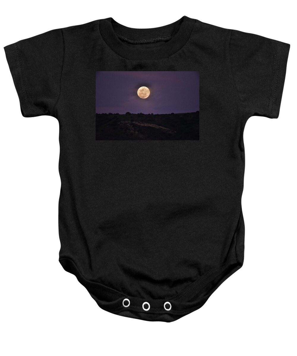Linda Brody Baby Onesie featuring the photograph Full Moon Rising Over Silhouetted Hillside with Purple Sky 3 by Linda Brody