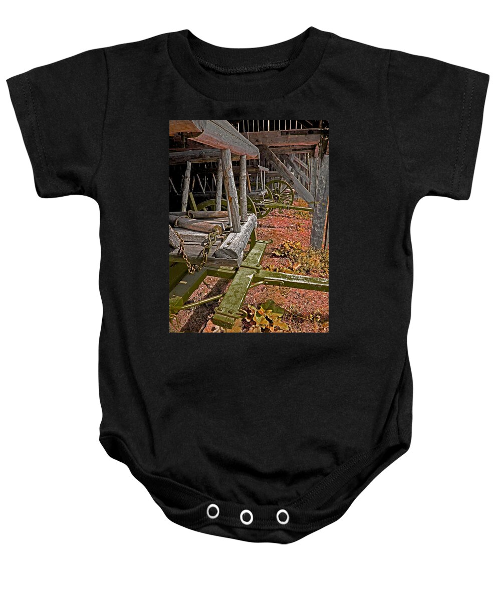 Hay Wagon Baby Onesie featuring the photograph Hay Wagons in a Barn by Mark Sellers