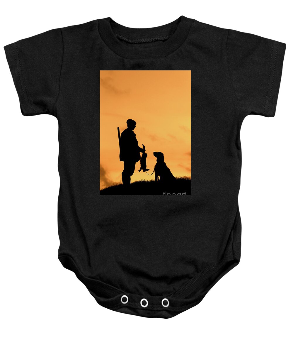 Hunter Baby Onesie featuring the photograph Hunter with Dog at Sunset by Arterra Picture Library