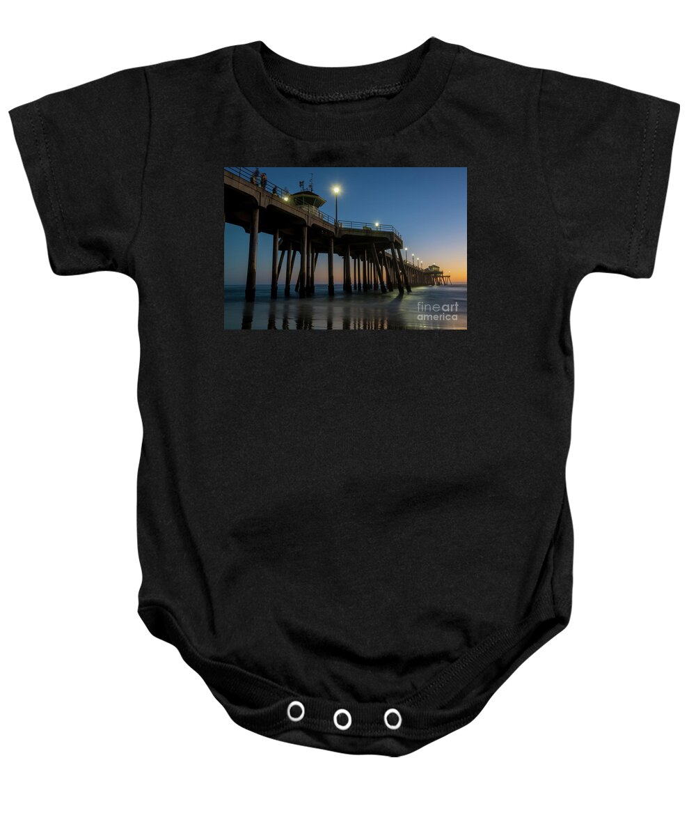 Huntington Beach Baby Onesie featuring the photograph Huntington Beach pier at dusk by Paul Quinn