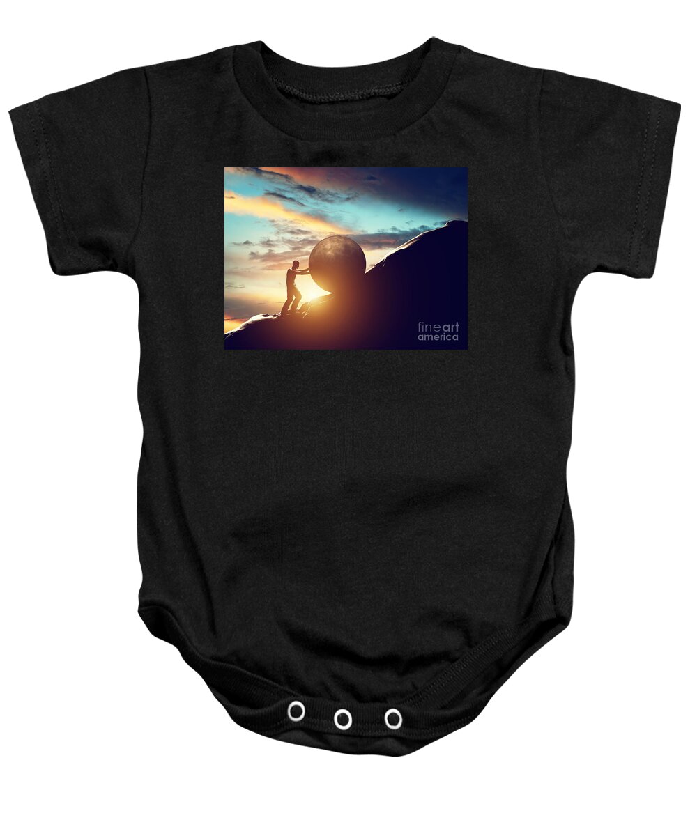 Sisyphus Baby Onesie featuring the photograph Man rolling huge concrete ball up hill by Michal Bednarek