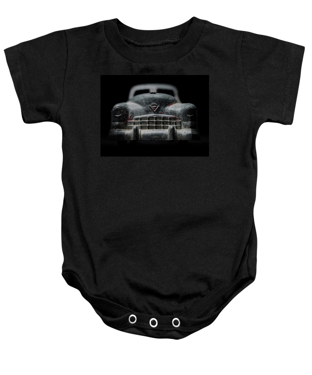 Old Toy Baby Onesie featuring the photograph Old Silver Cadillac Toy Car with specks of red paint by Art Whitton