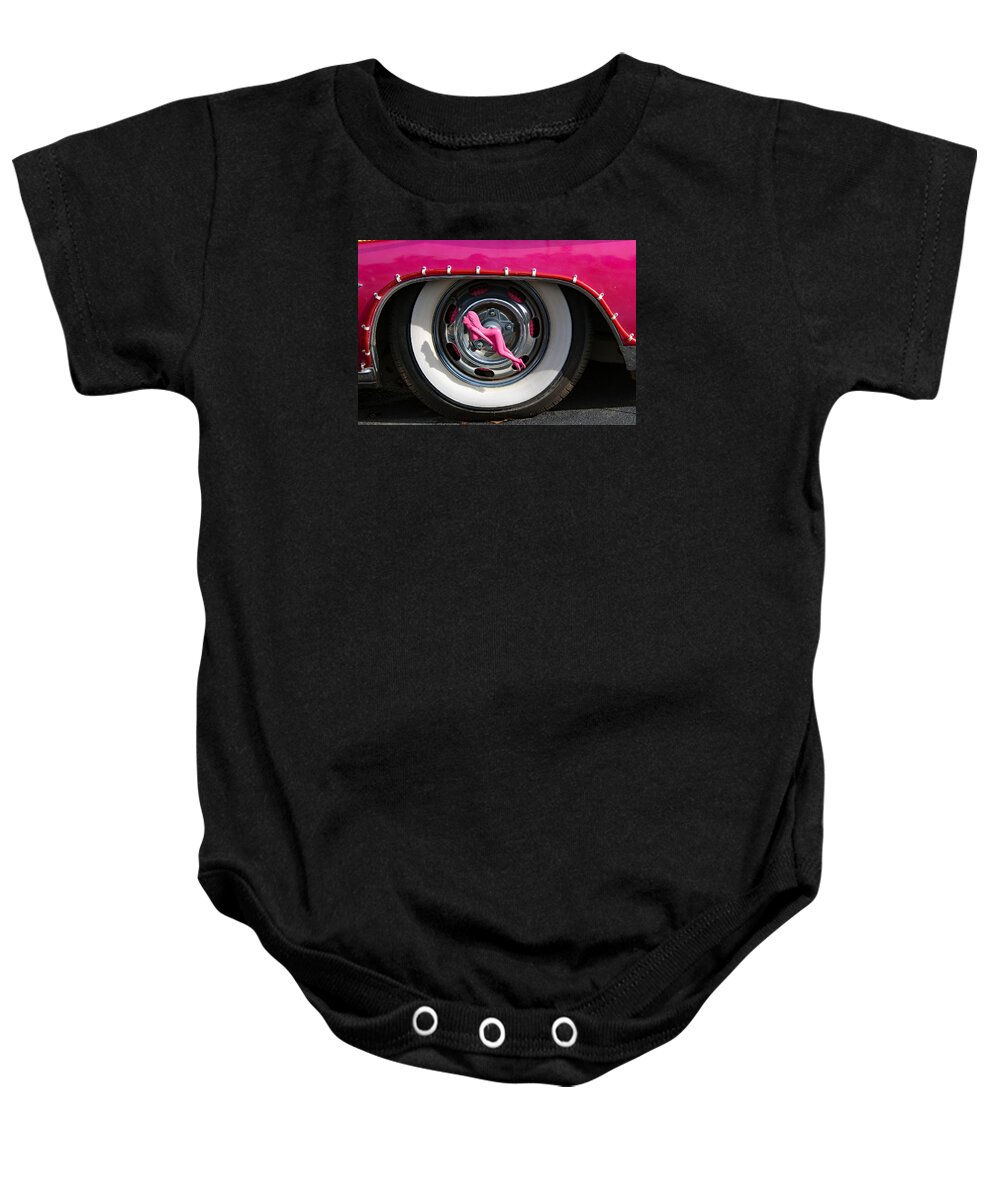 Automobile Baby Onesie featuring the photograph Pink Lady Hubcap 2 by DB Hayes