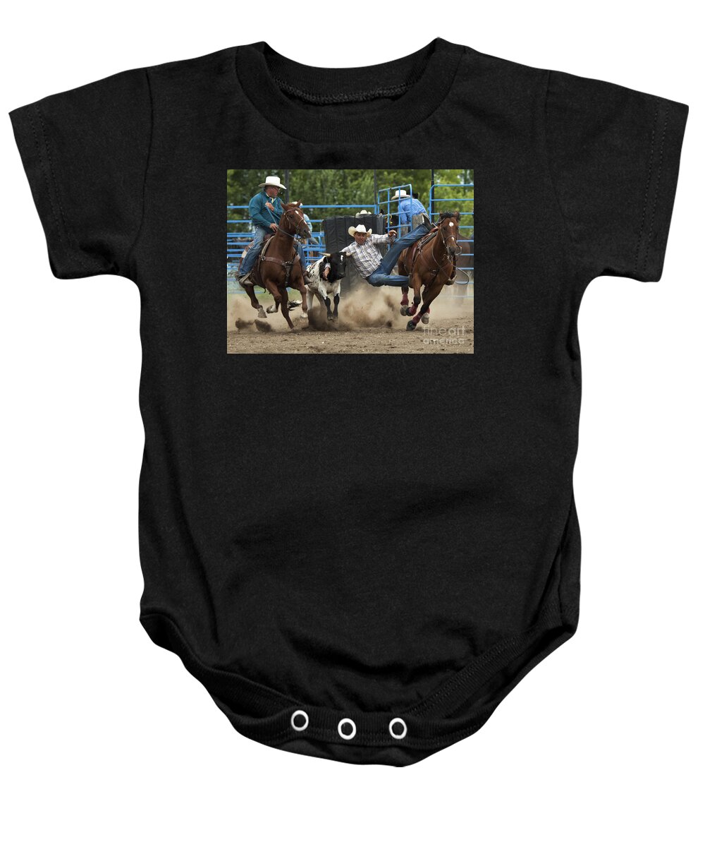 Steer Baby Onesie featuring the photograph Rodeo Steer Wrestling 1 by Bob Christopher