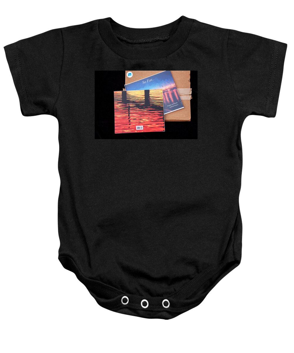  Baby Onesie featuring the photograph So Far Back Cover by Rich Franco