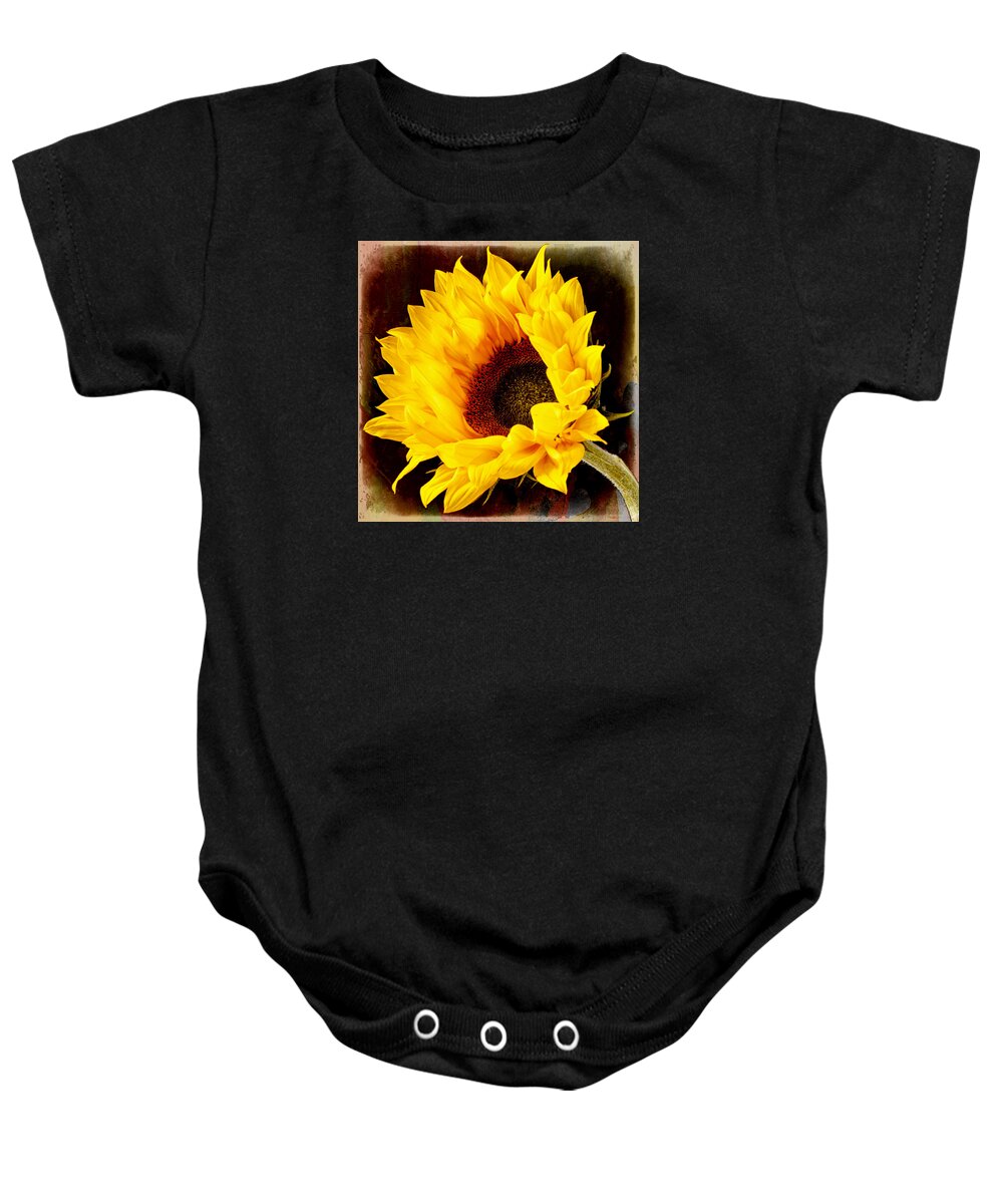 Sunflower Baby Onesie featuring the photograph Sunflower on painted background. by John Paul Cullen