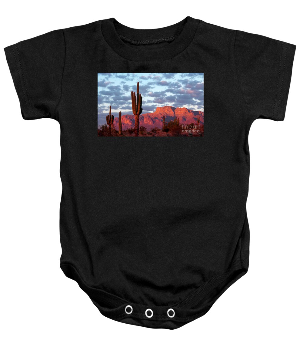 Superstition Mountains Baby Onesie featuring the photograph The Mountain is Pink Time to Drink, Superstitions AZ by Joanne West