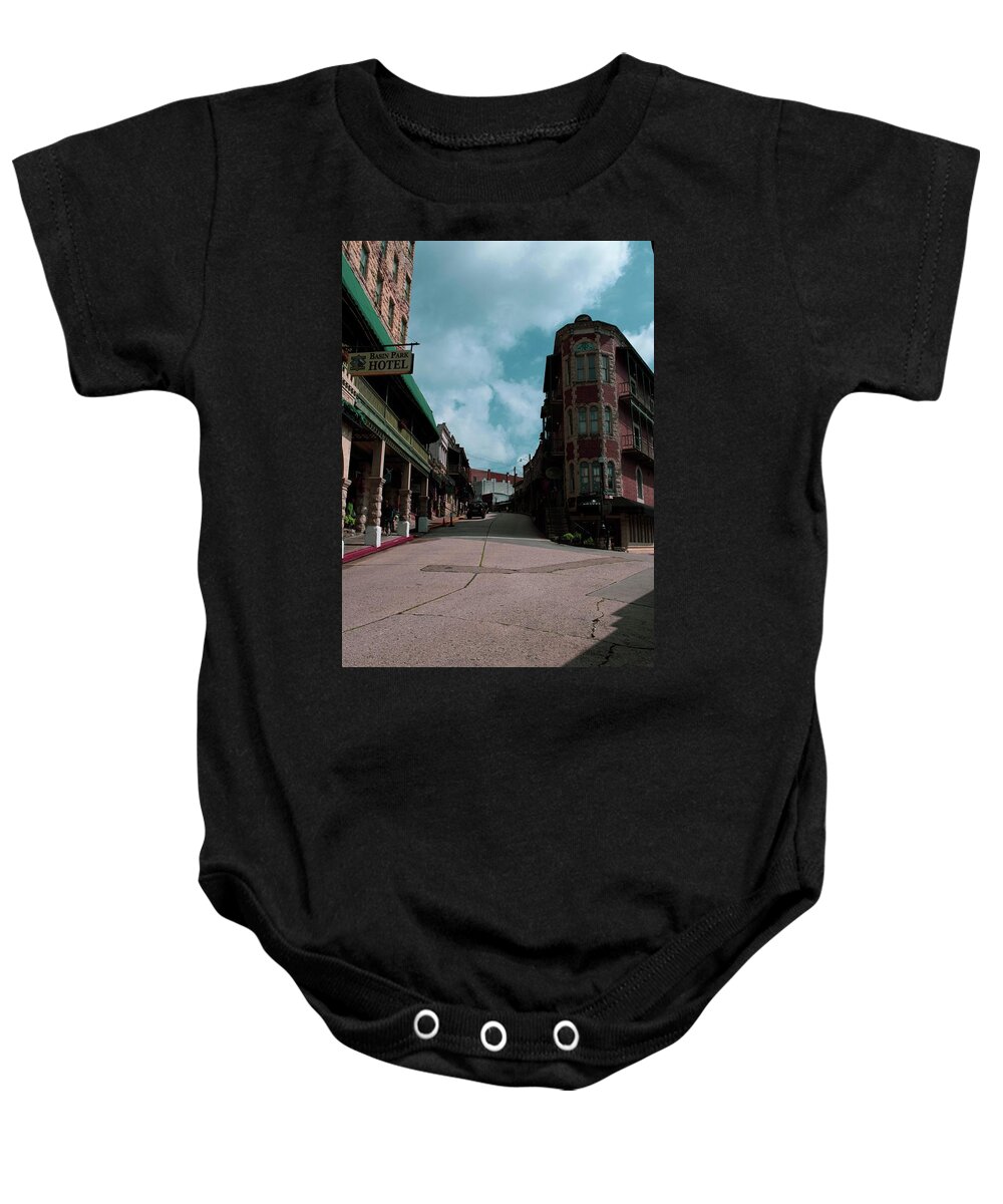 Street Baby Onesie featuring the photograph Flatiron by Kelly Thackeray