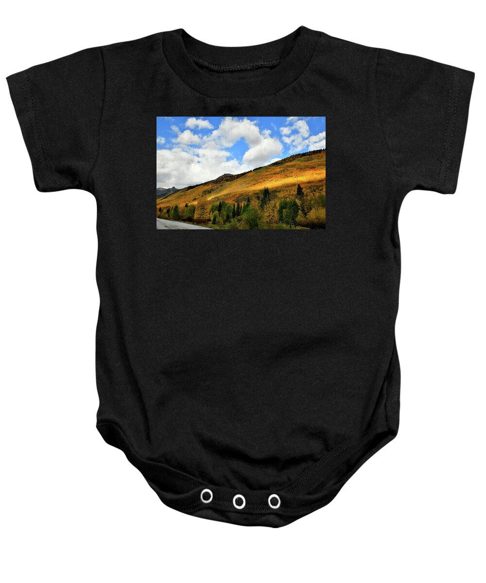 Red Mountain Pass Baby Onesie featuring the photograph Light Breaks Through onto Fall Colors by Ray Mathis