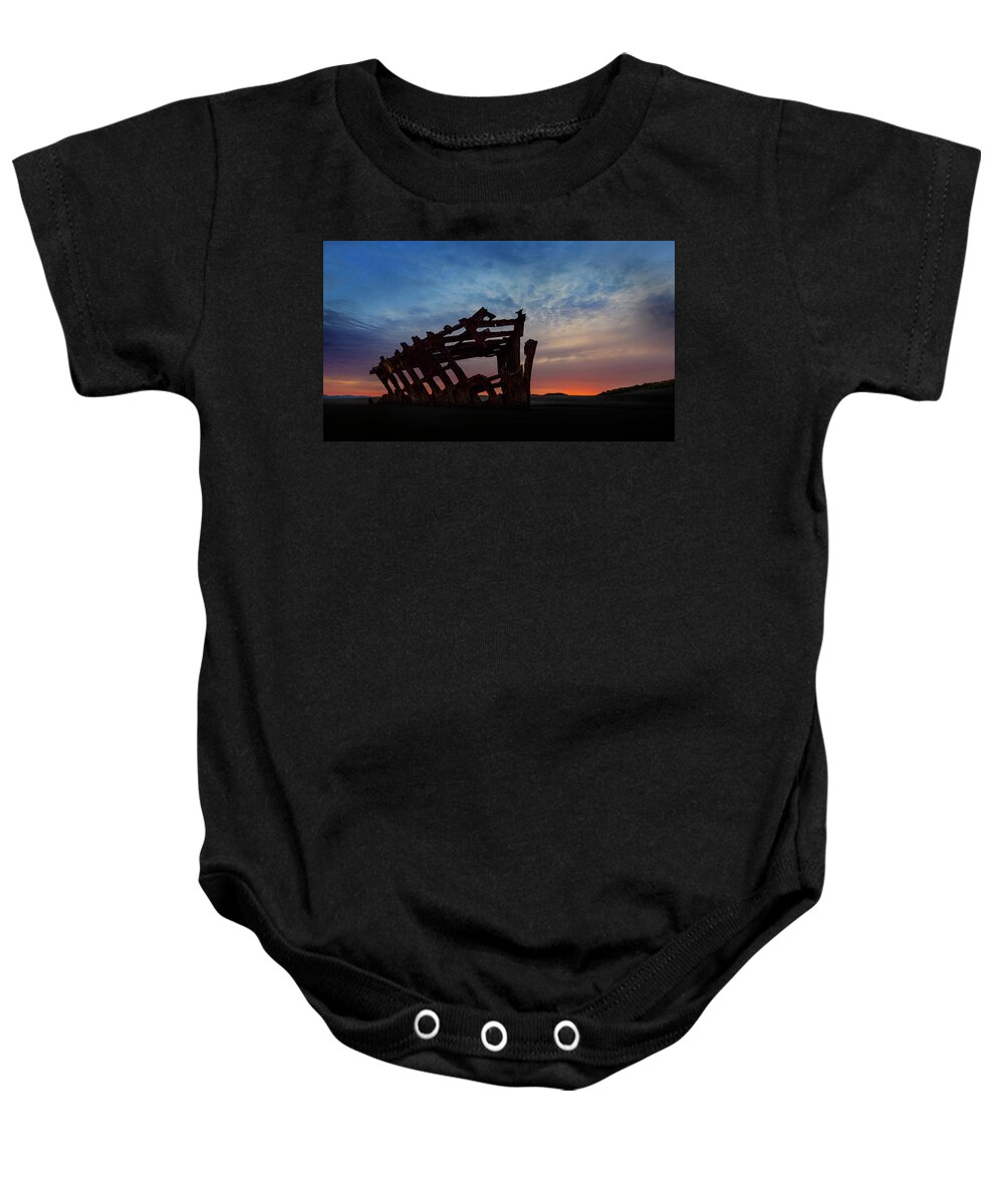 The Wreck Of The Peter Iredale Baby Onesie featuring the photograph The Wreck of the Peter Iredale III by John Poon