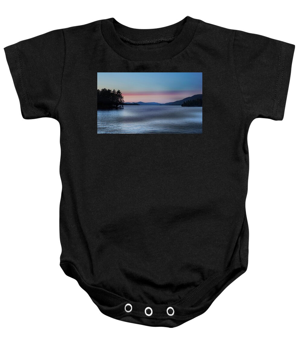 Sun Baby Onesie featuring the photograph Pink Clouds and Sunset Over Lake by Russel Considine