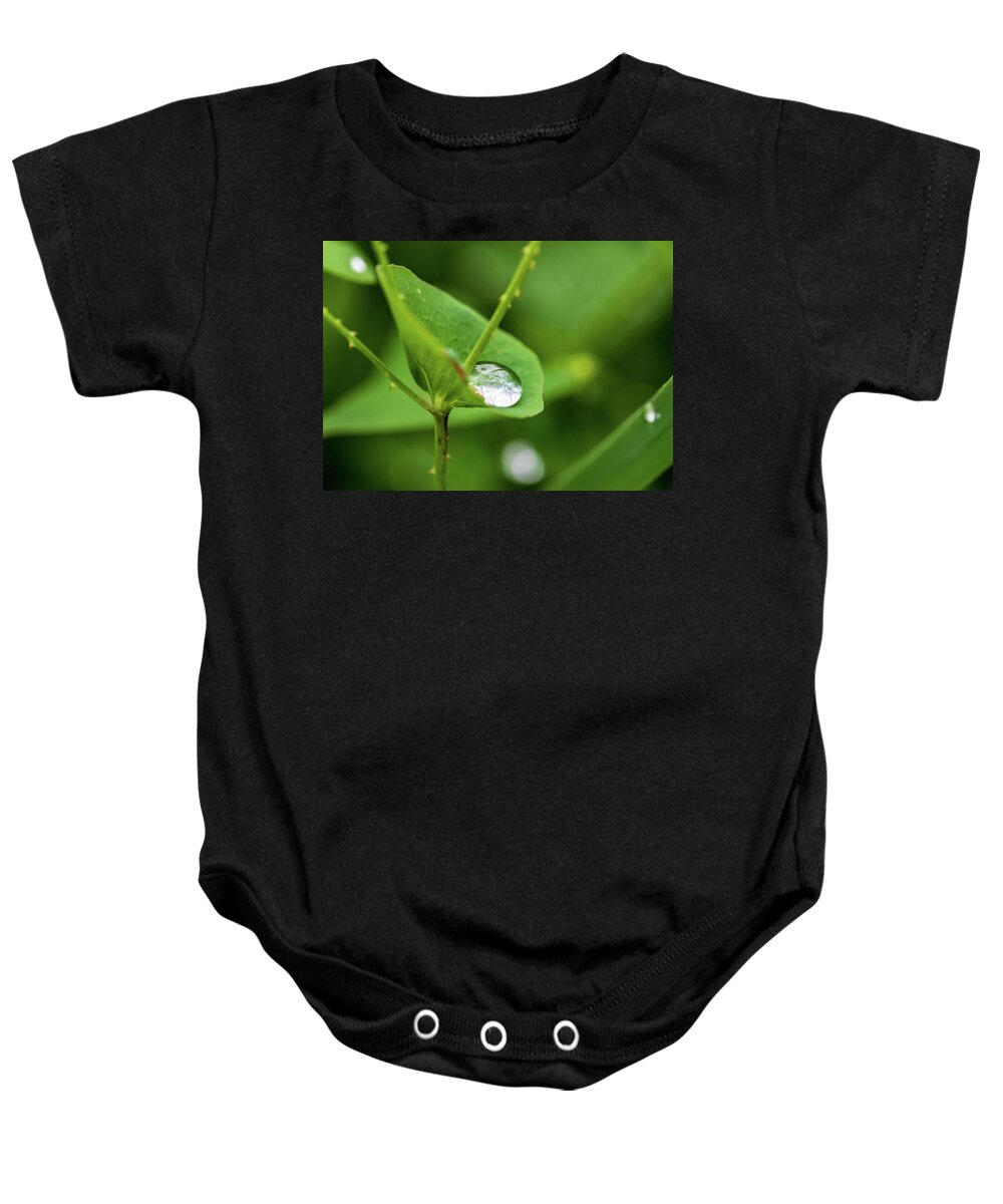 Leaf Baby Onesie featuring the photograph Rain Drops On Green Leaves by Amelia Pearn