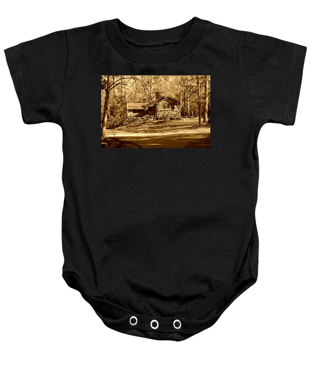 Stone Cabin Baby Onesie featuring the photograph Stone cabin in the Woods Sepia by Stacie Siemsen