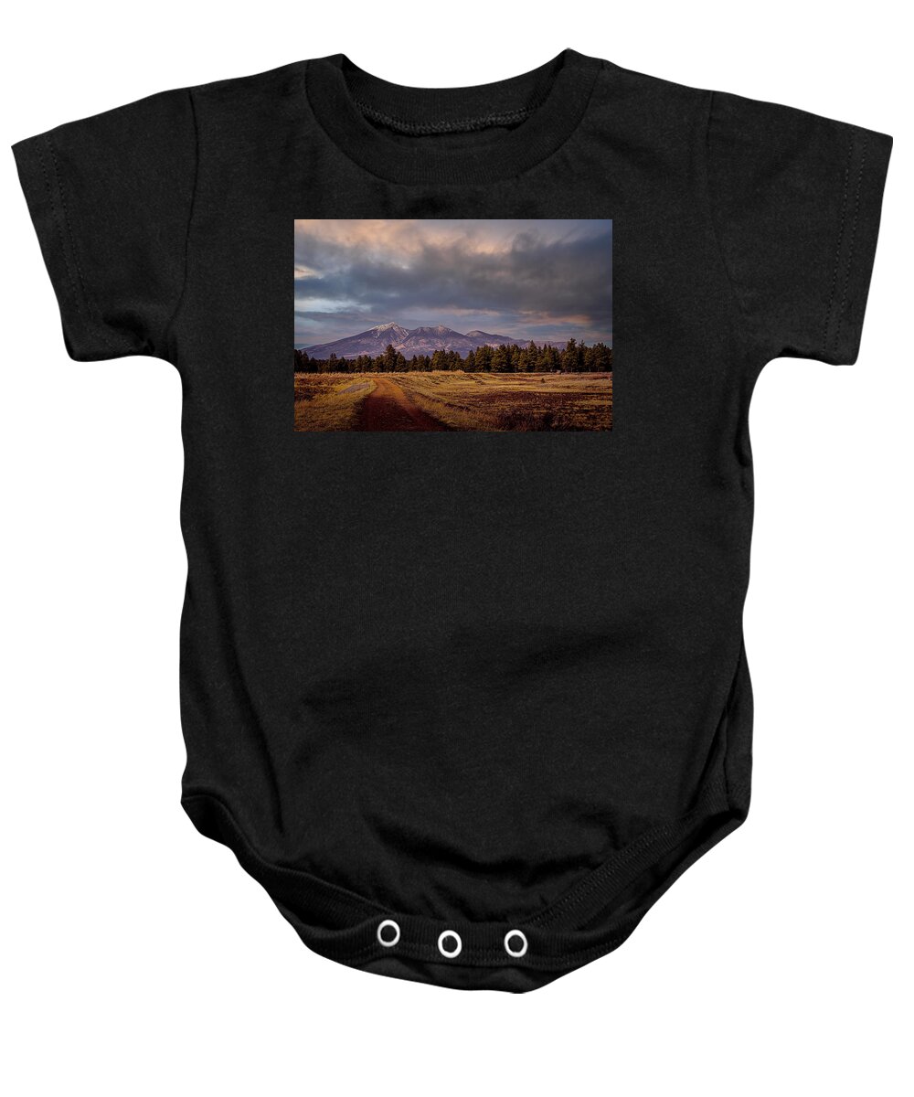 Wetlands Baby Onesie featuring the photograph Stormy Skies by Laura Putman