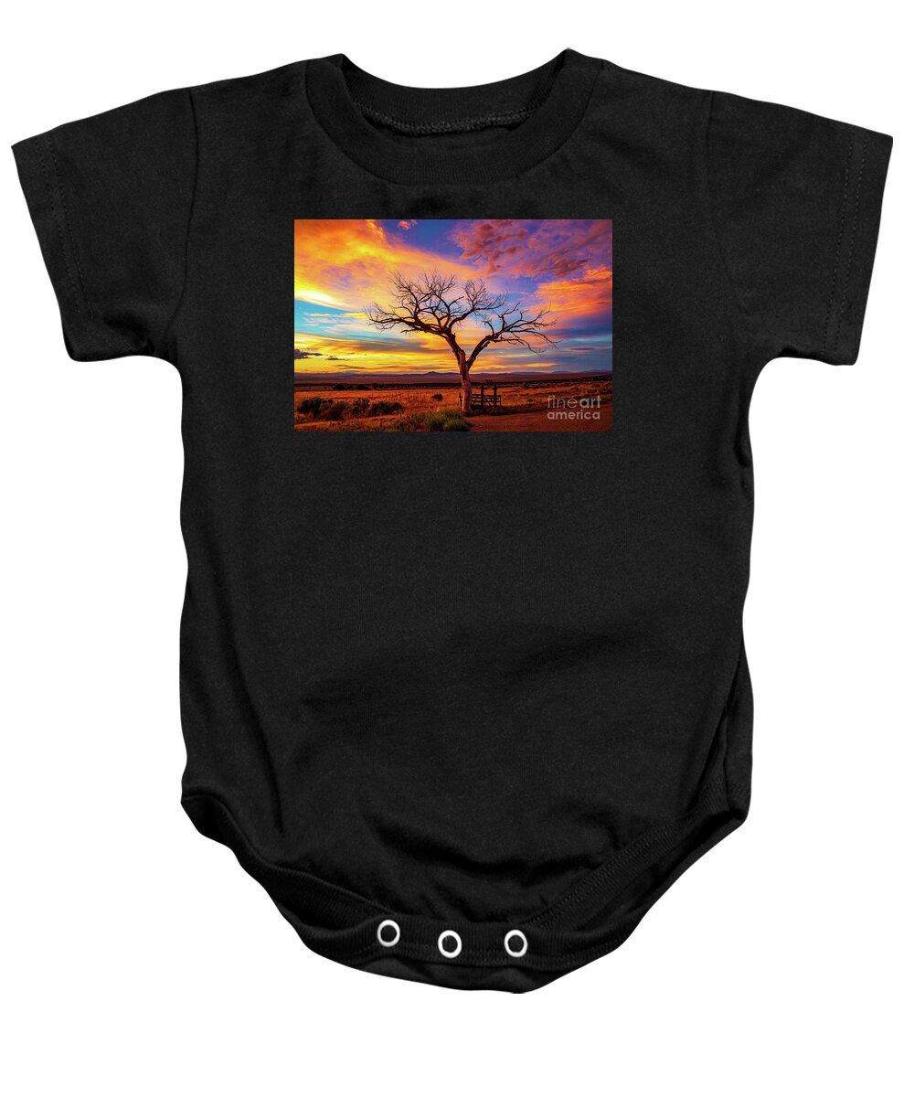 Taos Baby Onesie featuring the photograph Taos Welcome Tree with amazing sunset by Elijah Rael