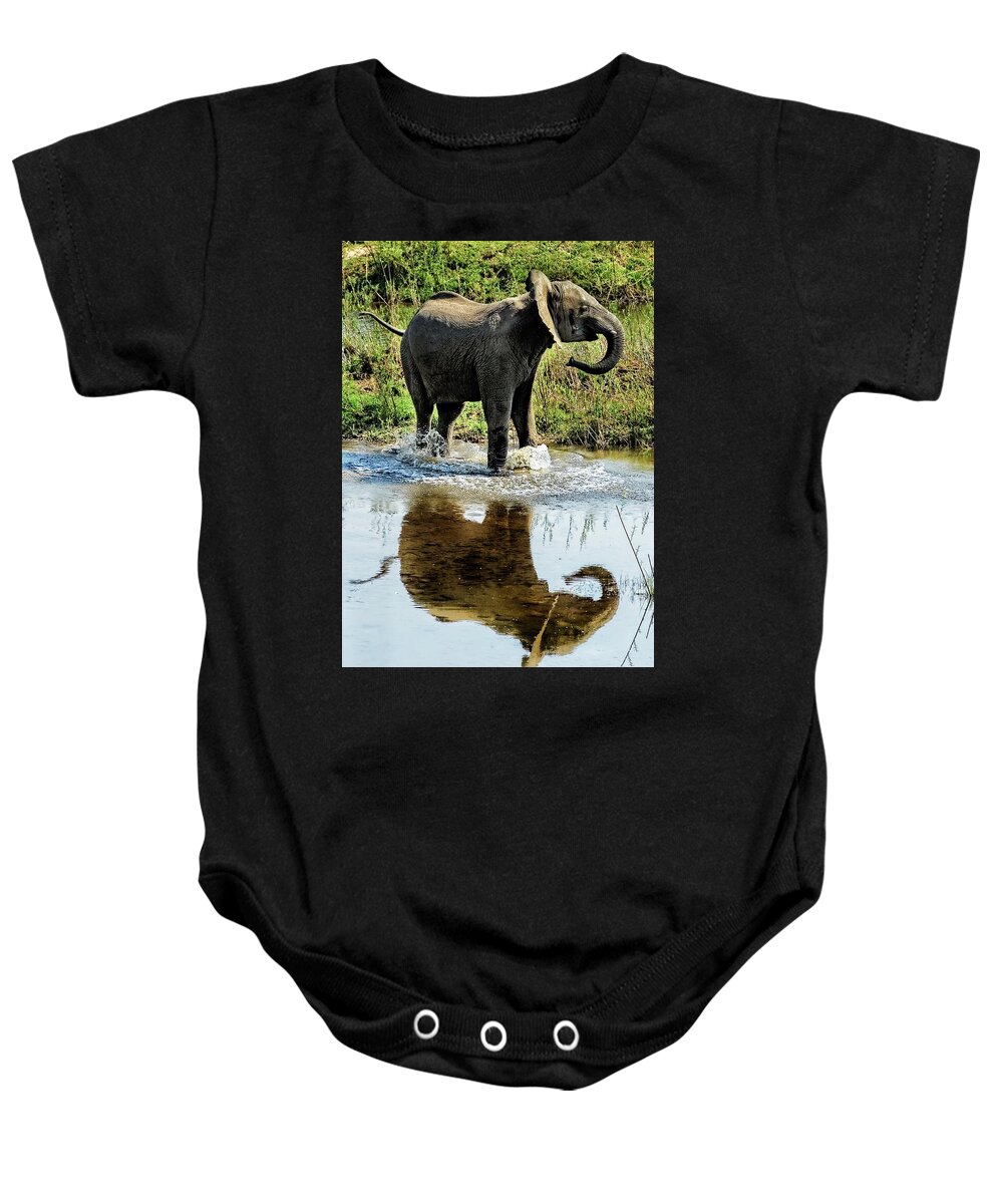 Elephant Baby Onesie featuring the photograph Young Elephant Playing in a Puddle by Kay Brewer