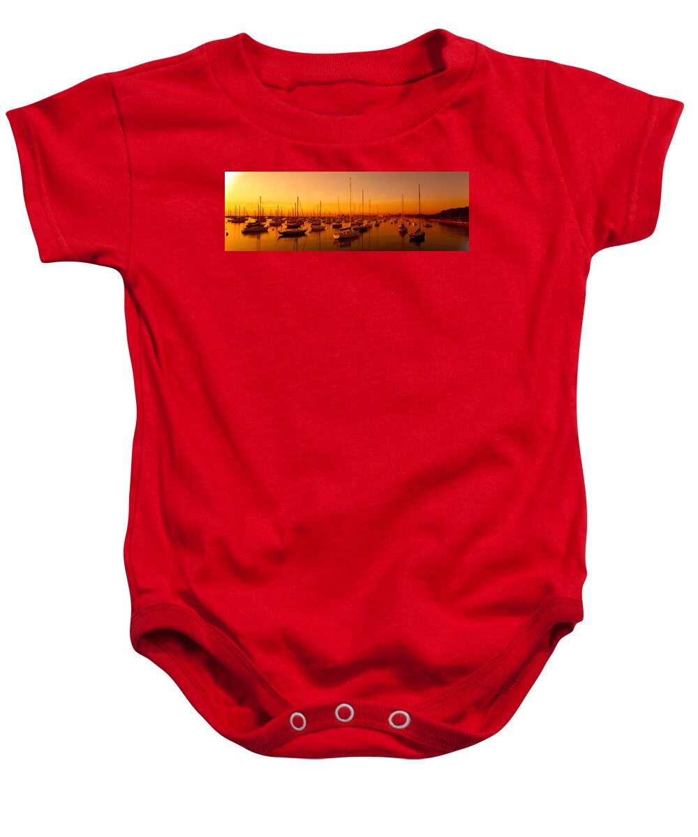 Photography Baby Onesie featuring the photograph Boats Moored At A Harbor At Dusk by Panoramic Images