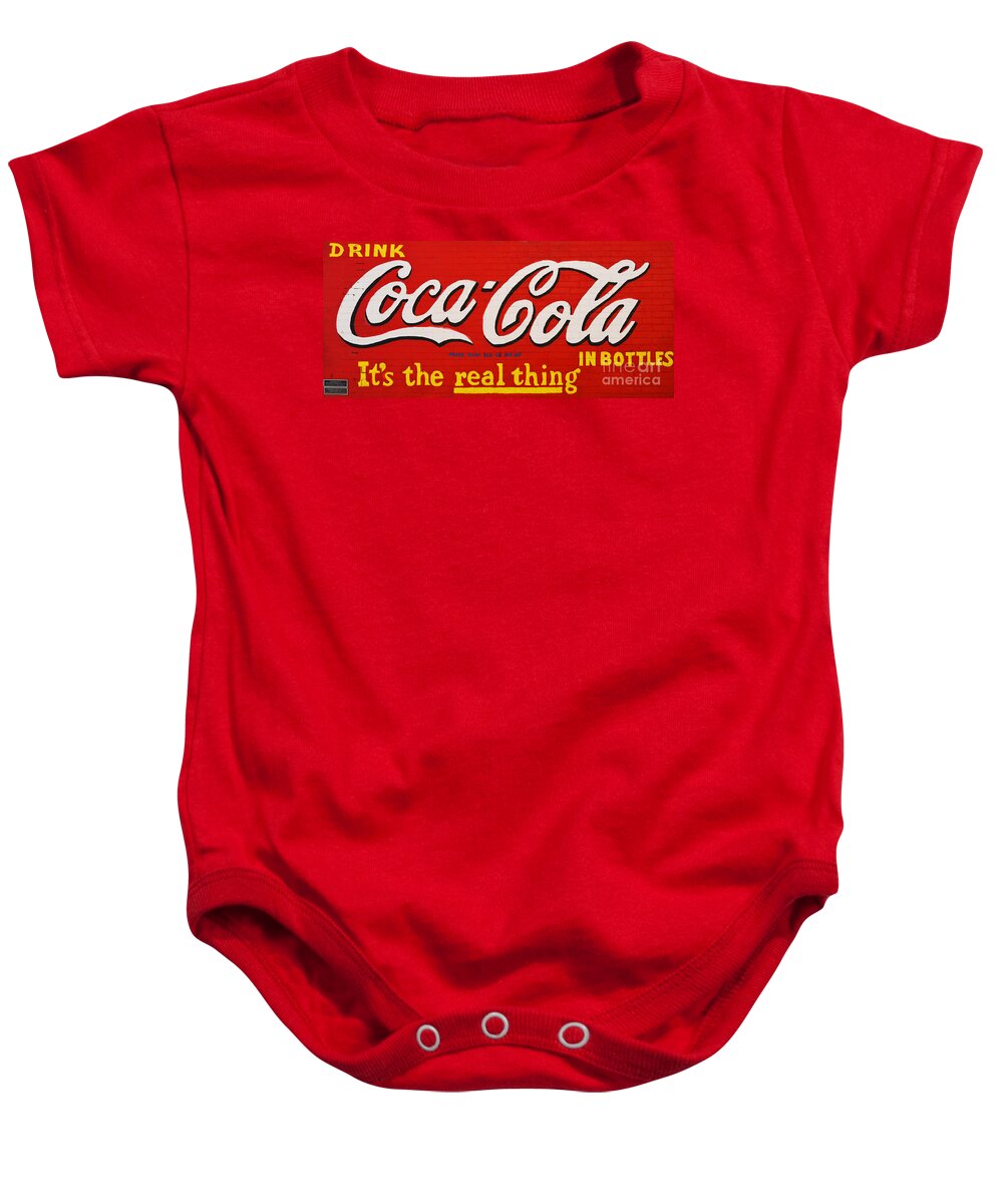 Coke Baby Onesie featuring the photograph Coca Cola Coke Vintage Americana Red Street Sign on a Brick Wall by Shawn O'Brien