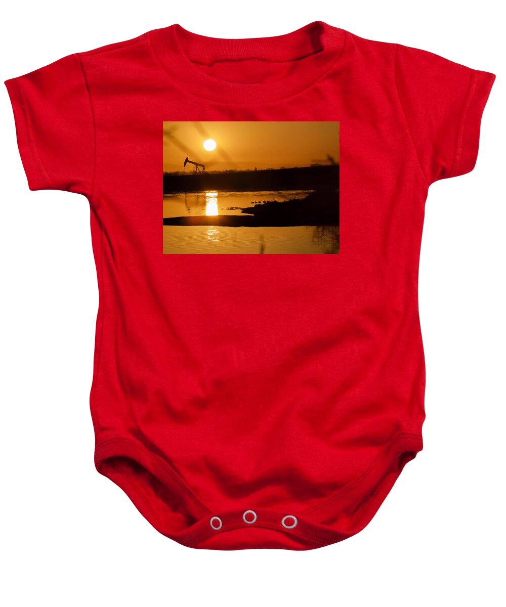 Bolsa Chica Baby Onesie featuring the photograph Oil Sunrise and Gold by Denise Dube