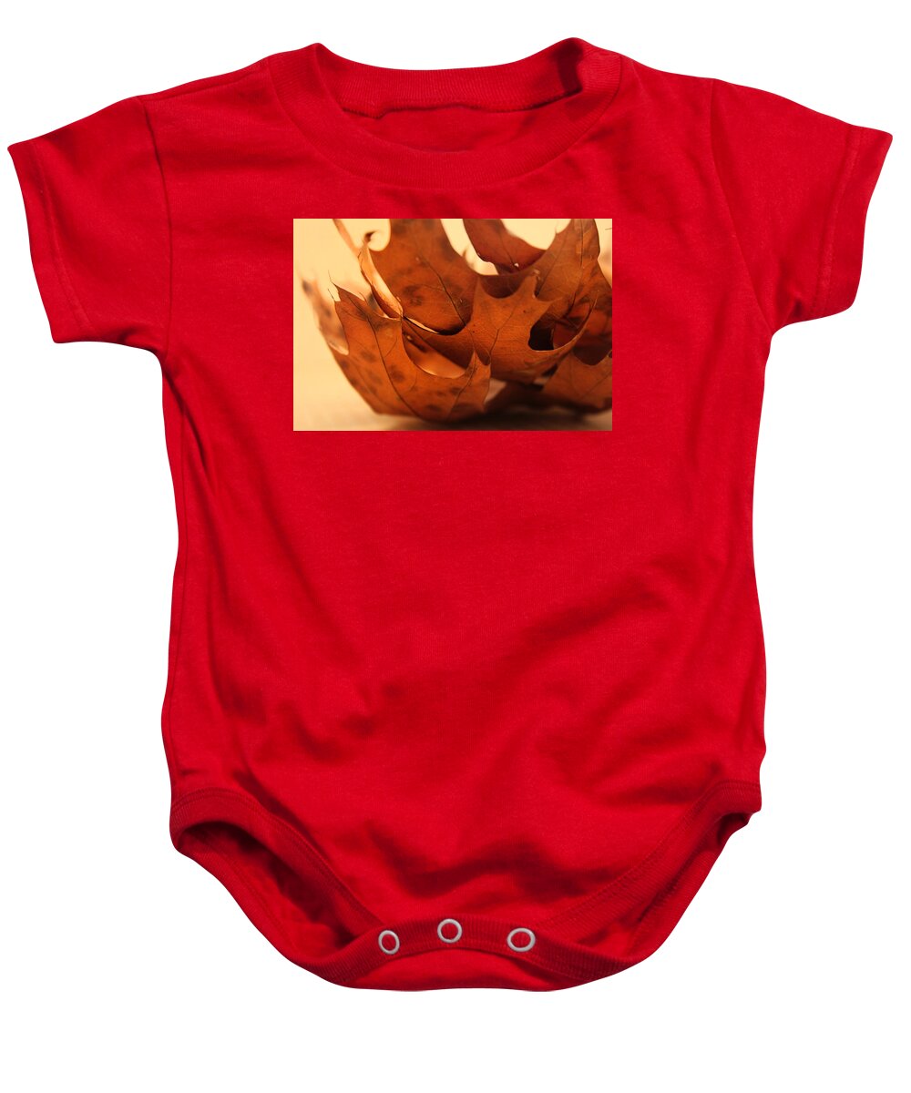 Kelly Baby Onesie featuring the photograph Stack of Brown Leaves in Color by Kelly Hazel
