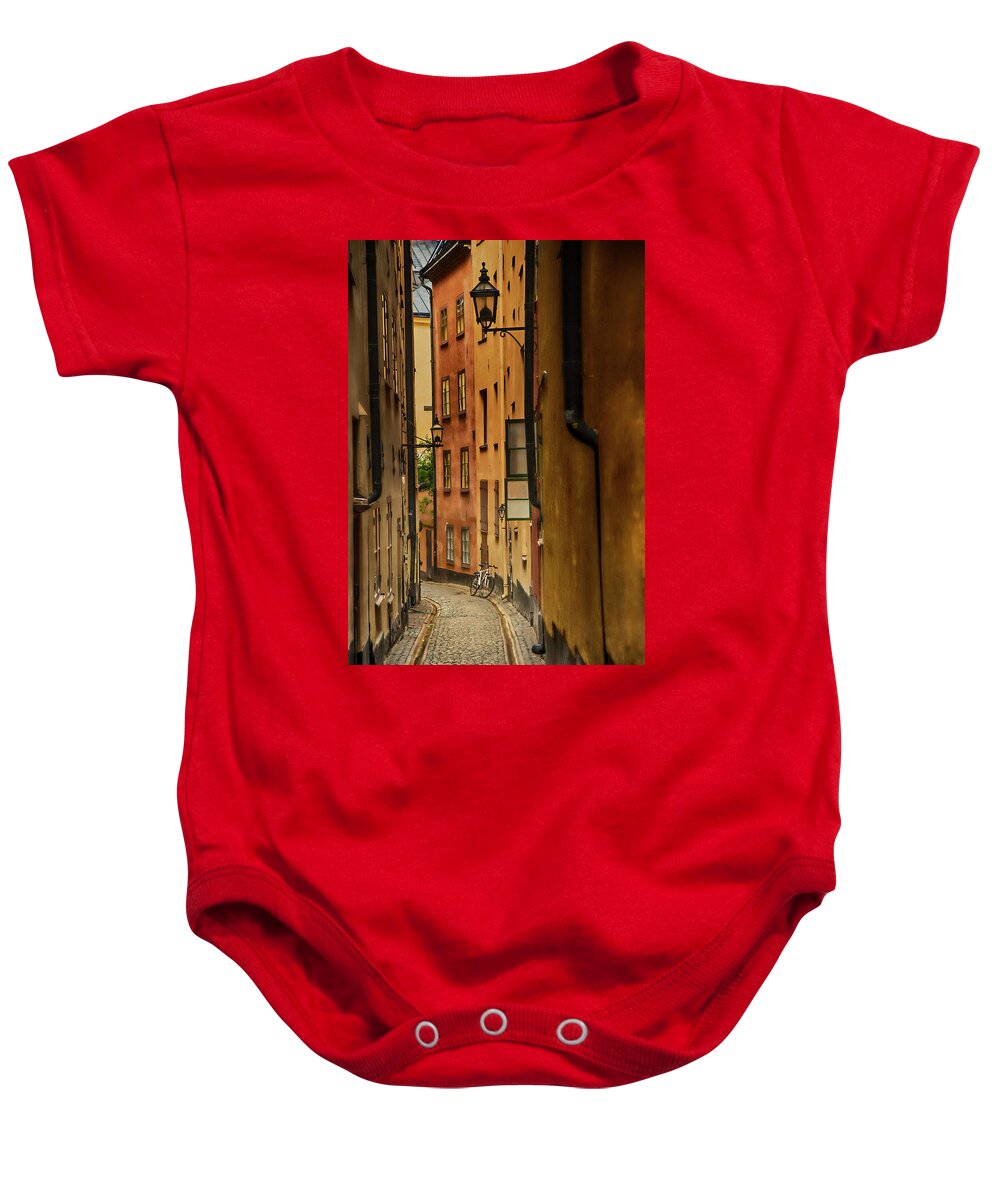 Stockholm Baby Onesie featuring the photograph A Side Street in Stockholm by Mick Burkey