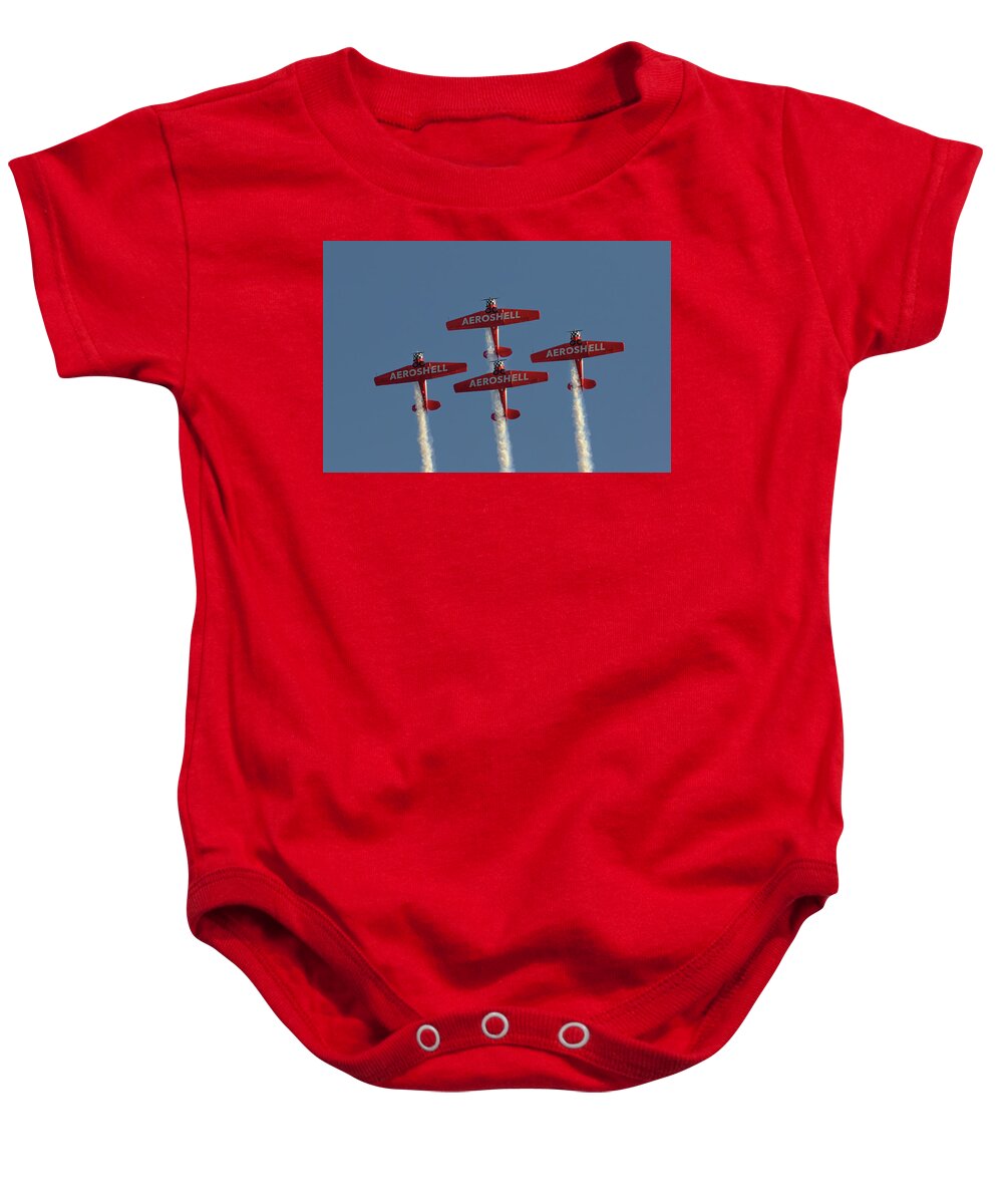 Aeroshell Baby Onesie featuring the photograph Aeroshell Aerobatic Team by Susan Rissi Tregoning