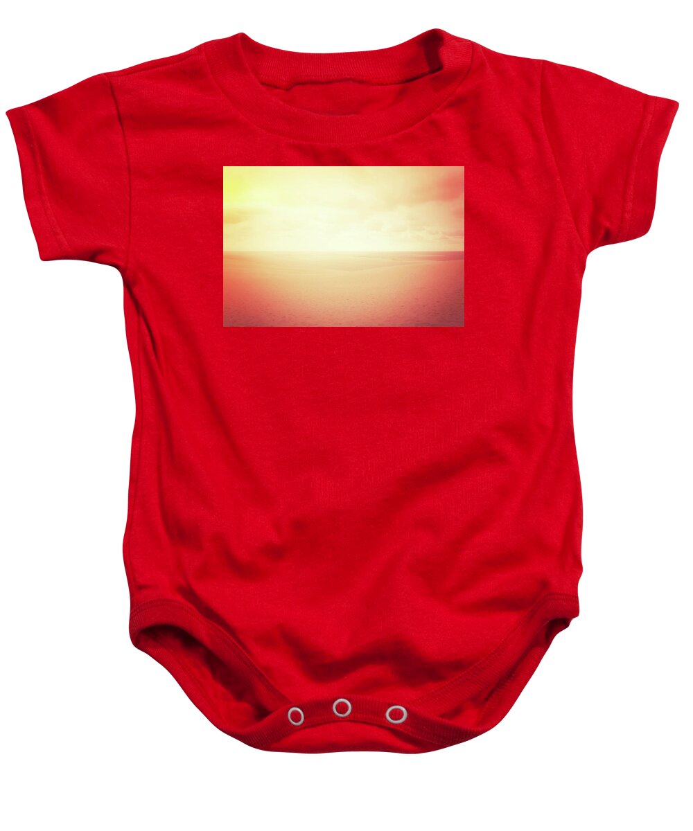Dune Baby Onesie featuring the photograph Hazy sand dunes in red glow by GoodMood Art