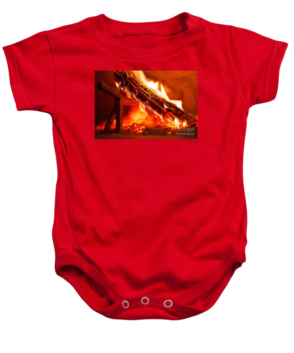 Brick Baby Onesie featuring the photograph Interior Of Wood Fired Brick Oven With Burning Log by JM Travel Photography
