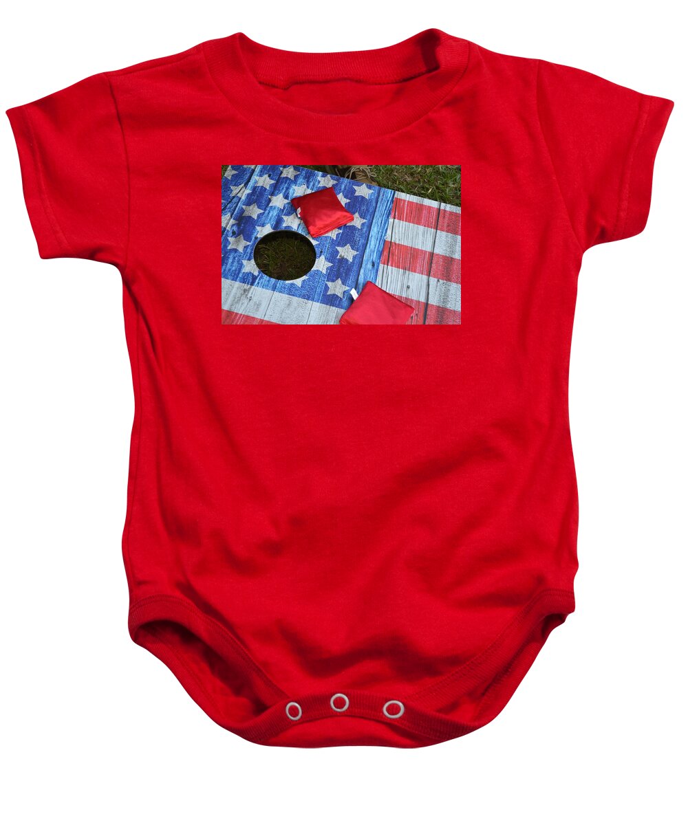 Patriotic Baby Onesie featuring the photograph Put it in the hole by Jeff Bjune