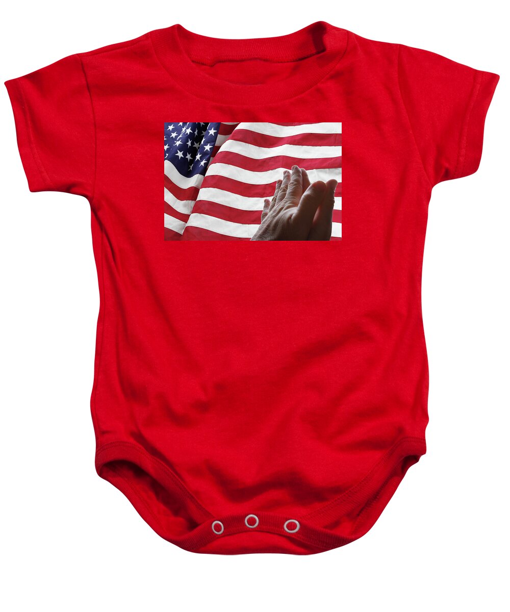 Prayer Baby Onesie featuring the photograph USA flag and prayer by Les Cunliffe