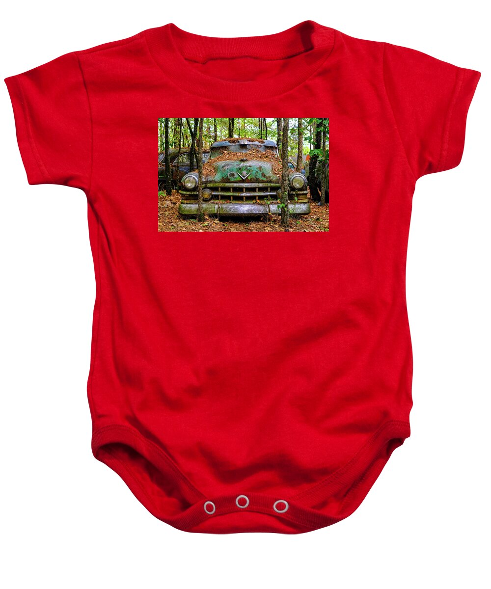 Abandoned Baby Onesie featuring the photograph Old Caddy into Trees by Darryl Brooks
