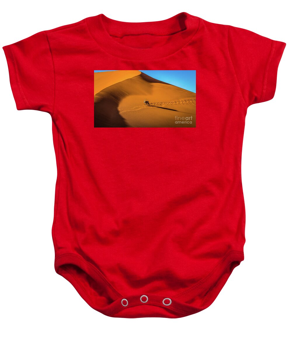 Dune Baby Onesie featuring the photograph Oryx crossing big daddy dune, Sossusvlei, Namibia by Lyl Dil Creations