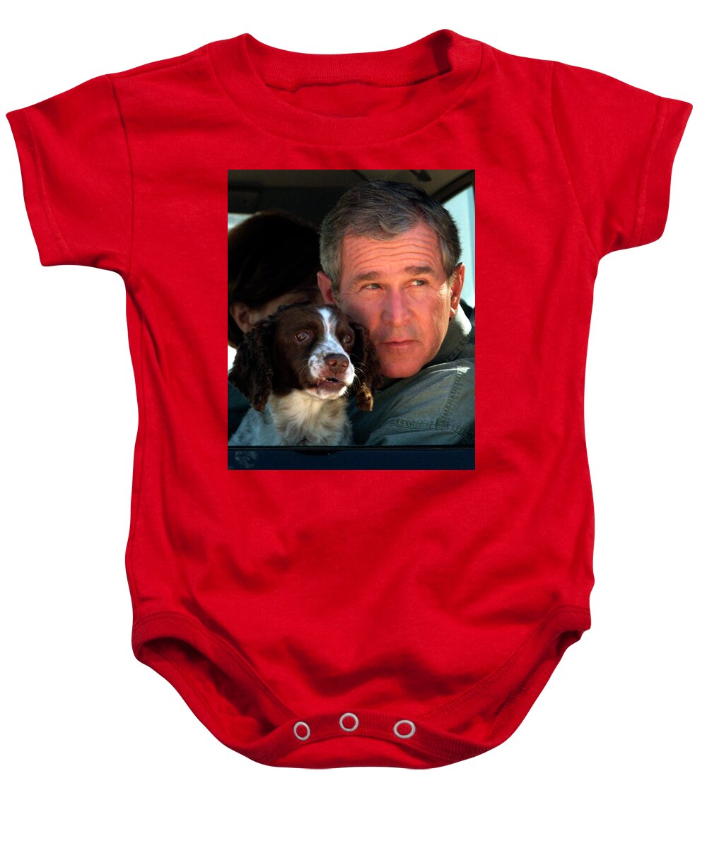 George W. Bush Baby Onesie featuring the photograph George W. Bush and Dog by Rick Wilking