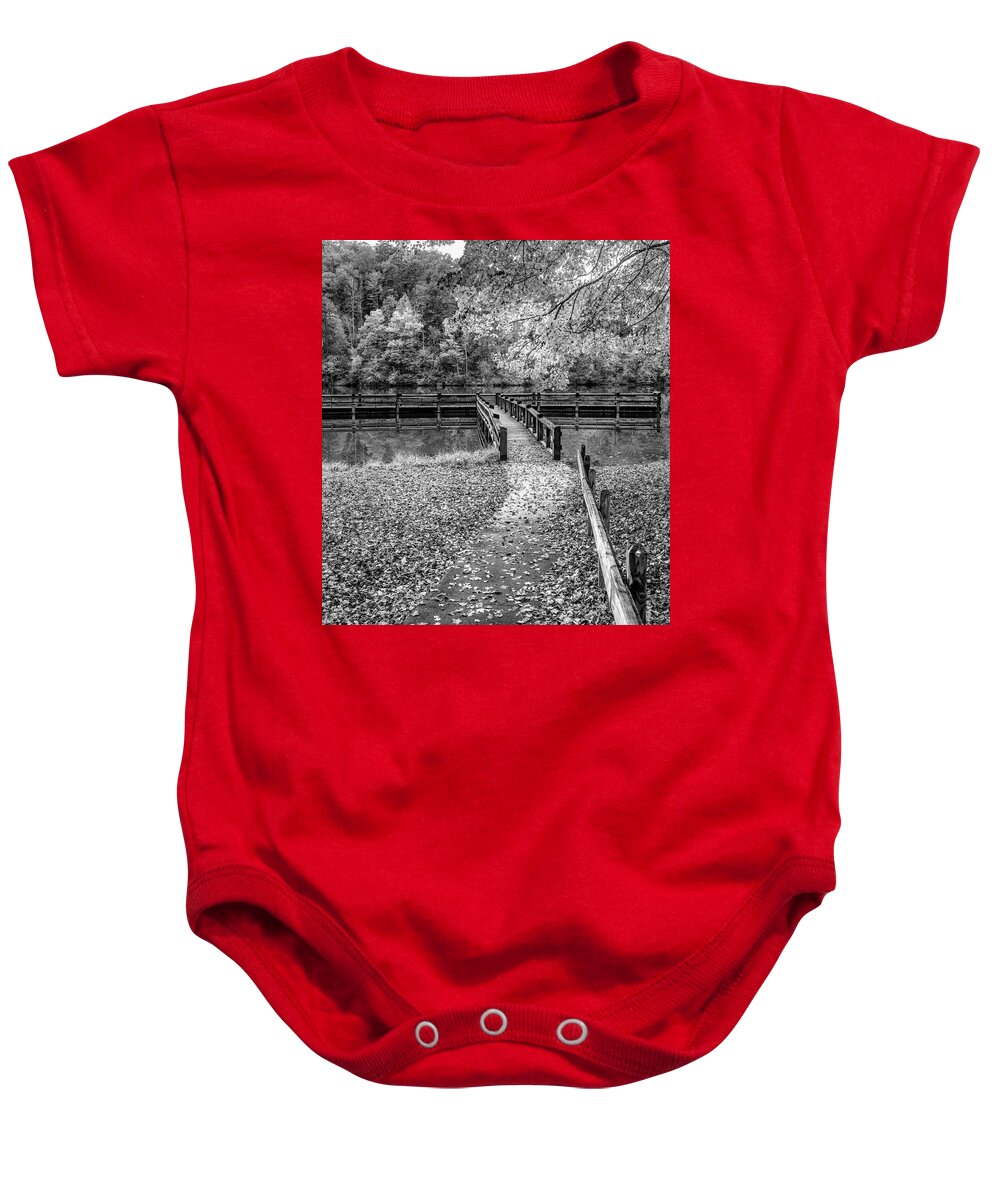 Black Baby Onesie featuring the photograph In the Fallen Autumn Leaves Black and White by Debra and Dave Vanderlaan
