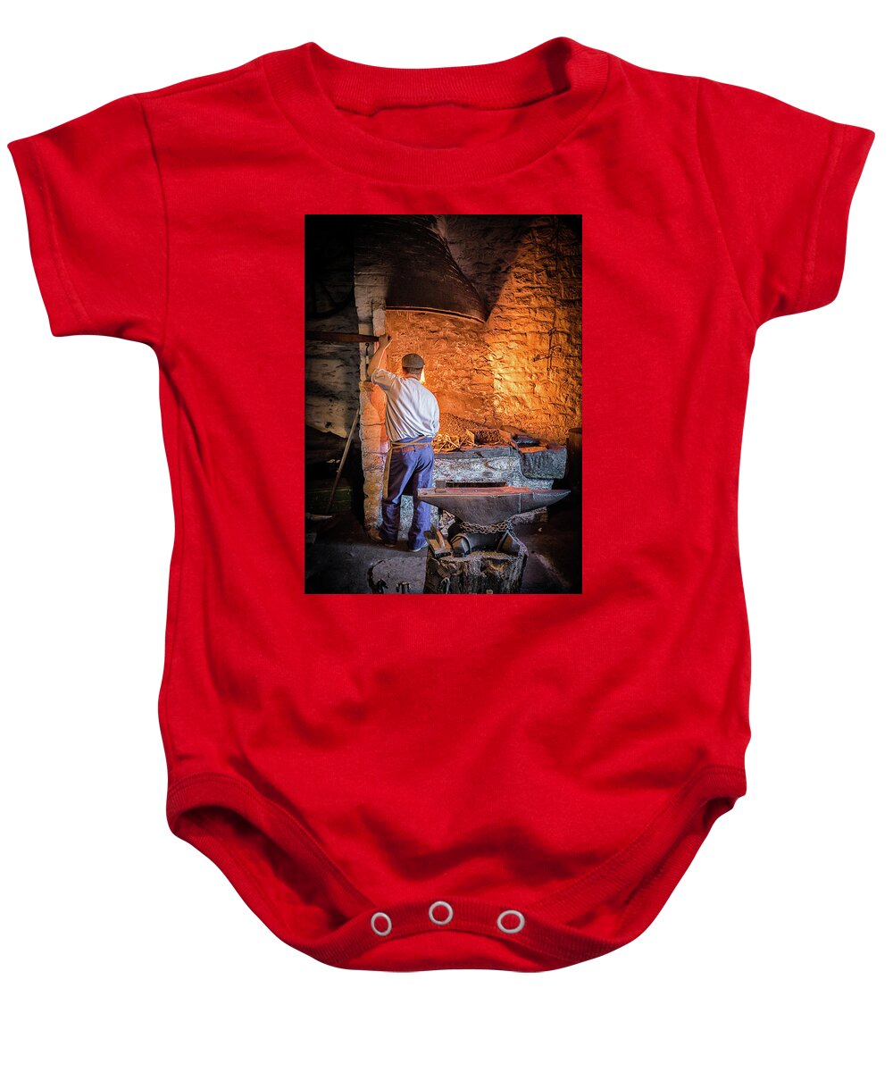 Blacksmith Baby Onesie featuring the photograph The Blacksmith 2 by Nigel R Bell