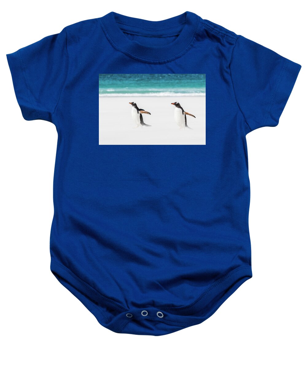 The Falklands Baby Onesie featuring the photograph Gentoo penguins caught in a sand storm. by Usha Peddamatham