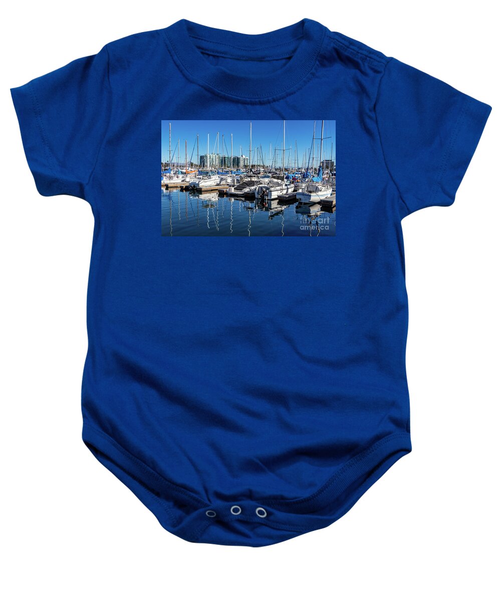 Sailboats Baby Onesie featuring the photograph Reflections of sailboats in blue water by Roslyn Wilkins