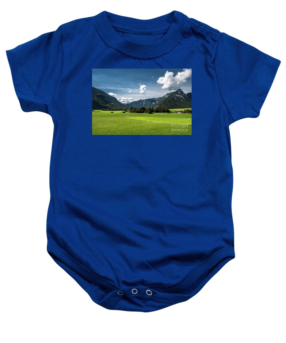 Austria Baby Onesie featuring the photograph Rural Landscape With Houses In Front Of Mountain Dachstein In The Alps Of Austria by Andreas Berthold