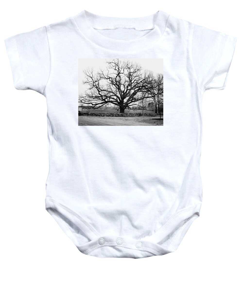 Exterior Baby Onesie featuring the photograph A Bare Oak Tree by Tom Leonard