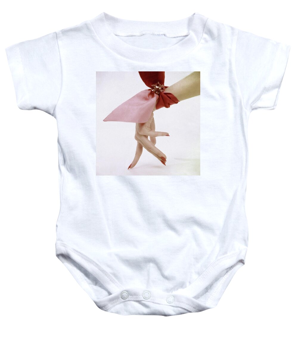 Accessories Baby Onesie featuring the photograph A Hand With A Wrist Scarf by Clifford Coffin