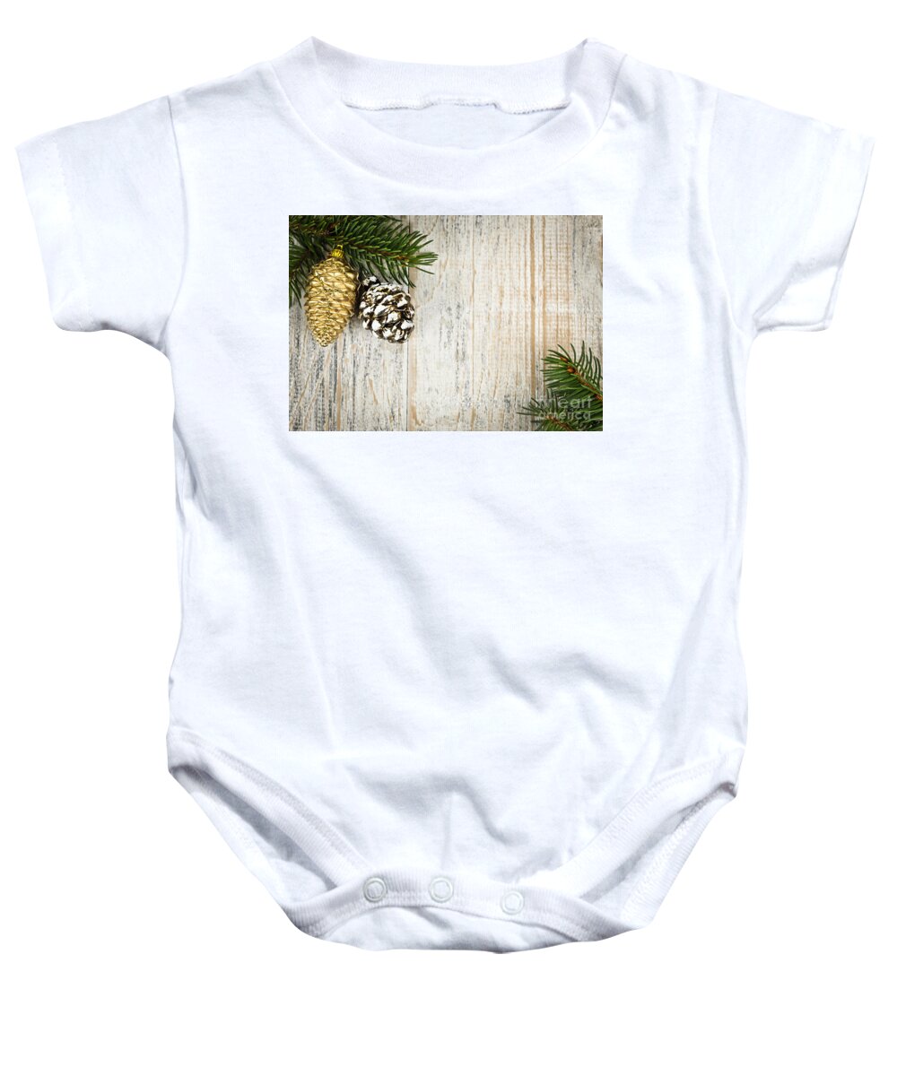 Christmas Baby Onesie featuring the photograph Christmas ornaments with pine branches by Elena Elisseeva