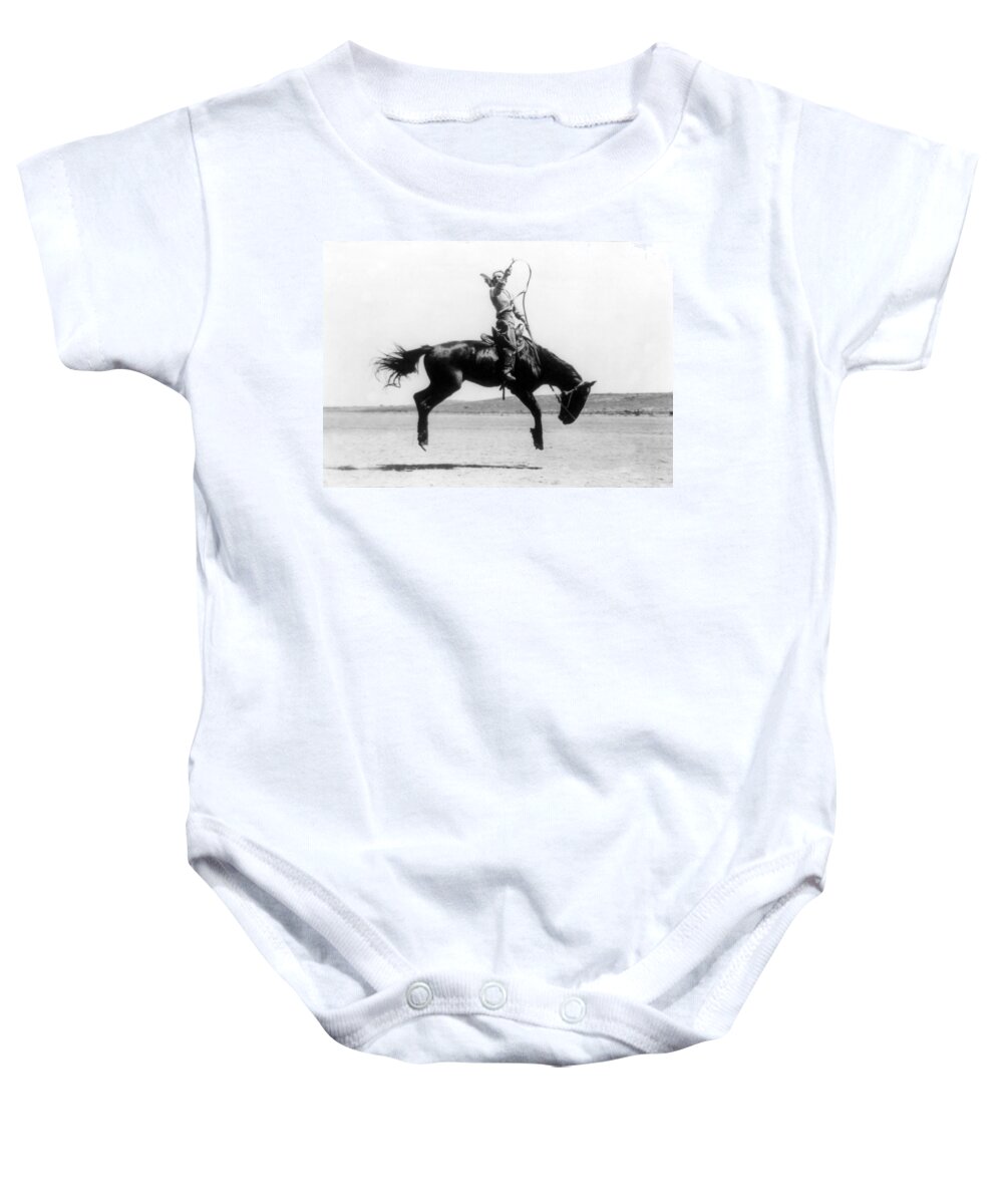 Occupation Baby Onesie featuring the photograph Cowgirl Riding Bucking Bronco, 1919 by Science Source