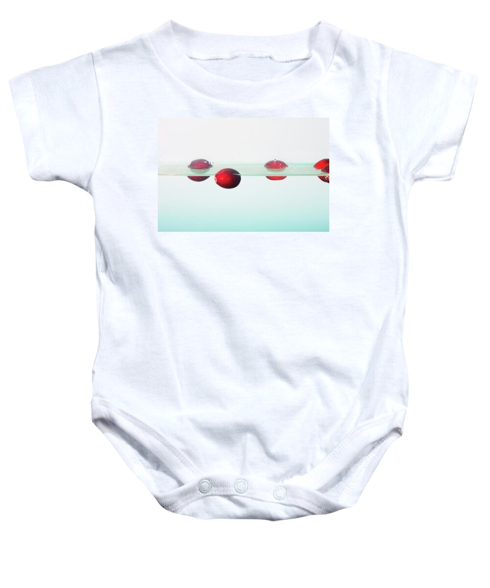 Cranberries Baby Onesie featuring the photograph Floating Cranberries by Diane Macdonald
