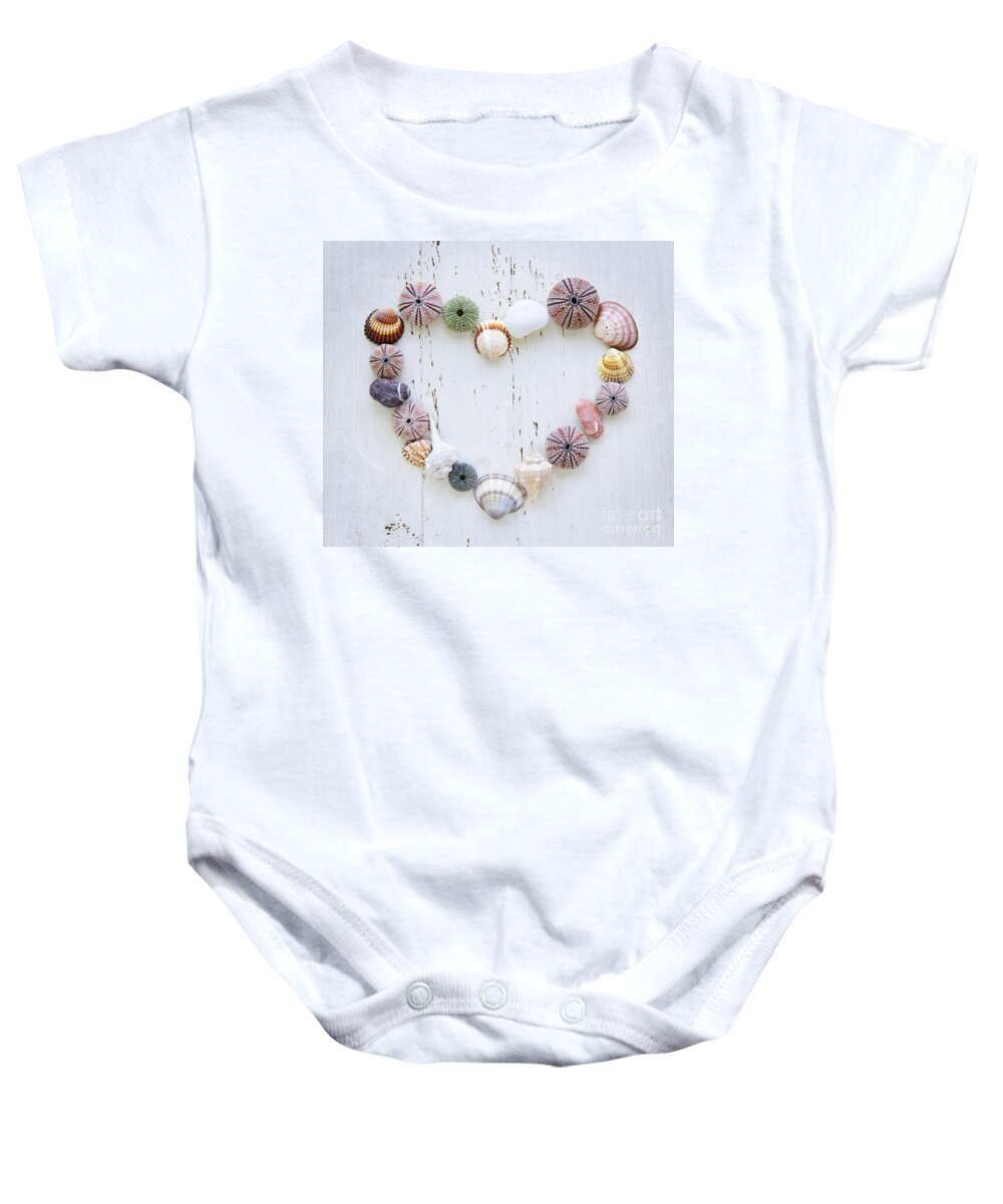 Heart Baby Onesie featuring the photograph Heart of seashells and rocks by Elena Elisseeva