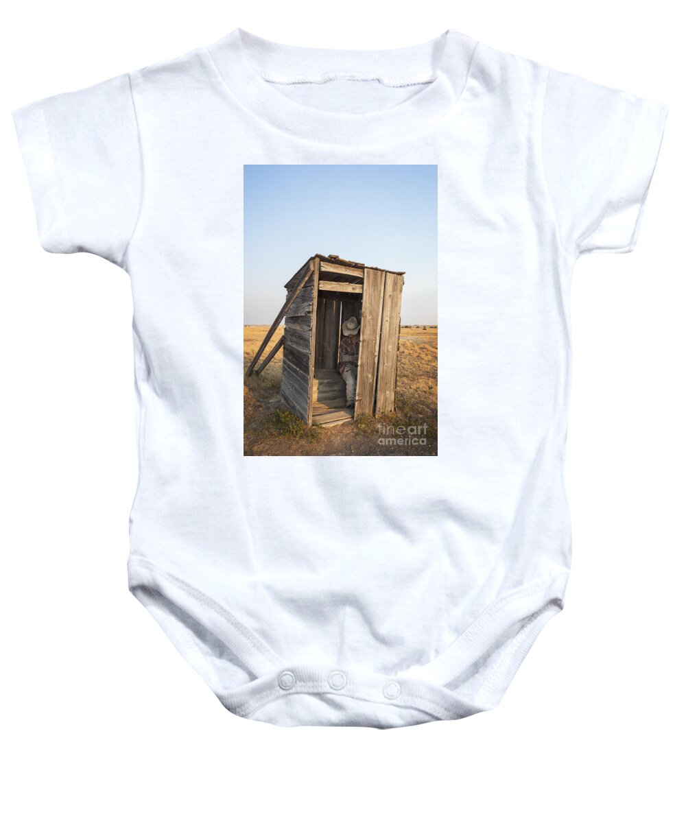 Mannequin Baby Onesie featuring the photograph Mannequin sitting in old wooden outhouse by Bryan Mullennix
