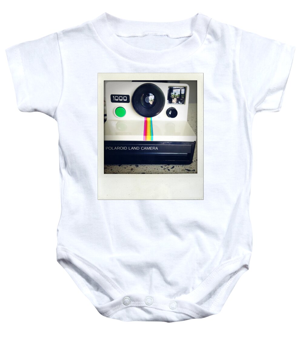 Aged Baby Onesie featuring the photograph Polaroid camera. by Les Cunliffe