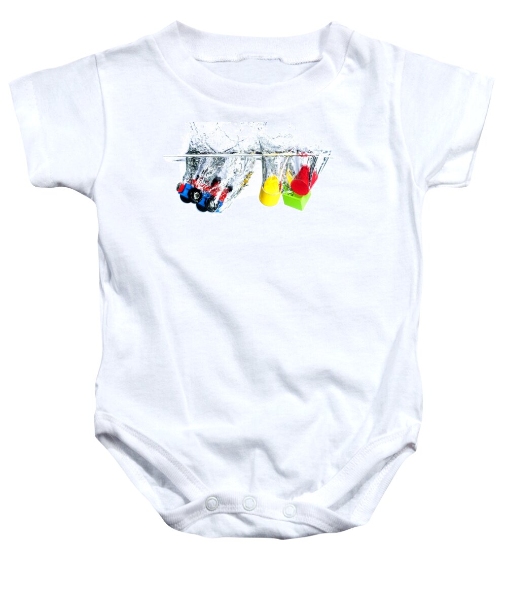 Toys Baby Onesie featuring the photograph Wooden toys in water by Mike Santis