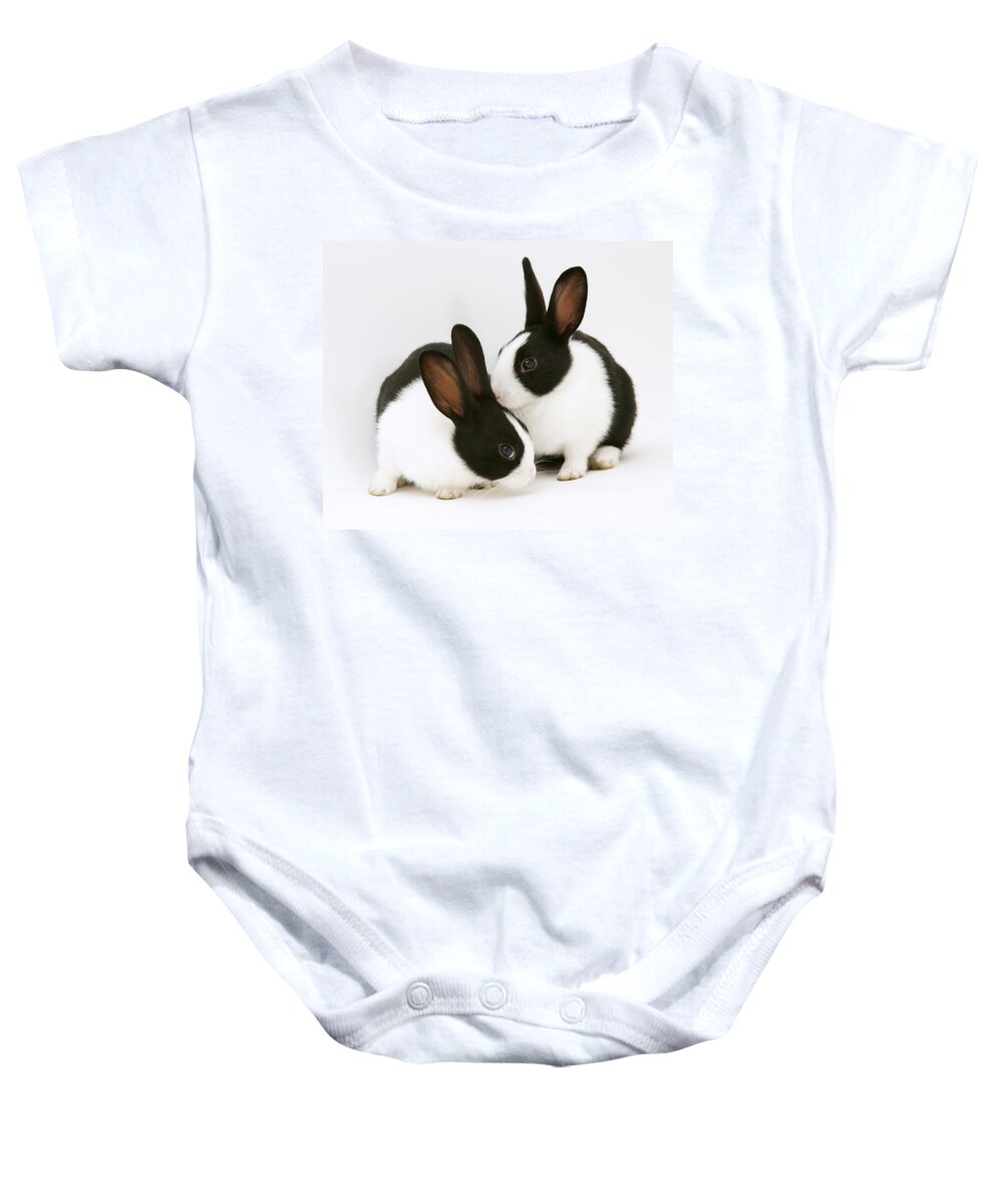 Black-and-white Dutch Rabbit Baby Onesie featuring the photograph Baby Black-and-white Dutch Rabbits #1 by Jane Burton