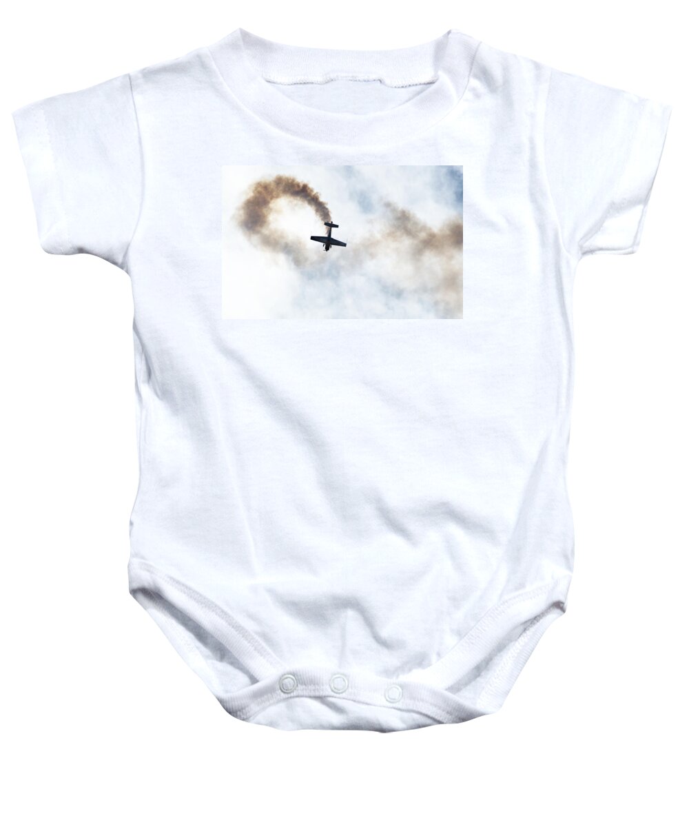 Aerobatic Baby Onesie featuring the photograph Extra 300 aerobatic plane and smoke trail by Chris Day