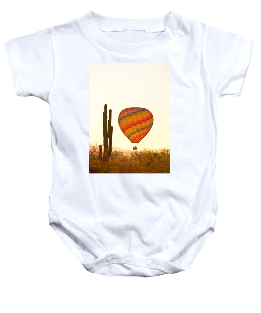 Arizona Baby Onesie featuring the photograph Golden Light Hot Air Balloon And Saguaro Cactus by James BO Insogna